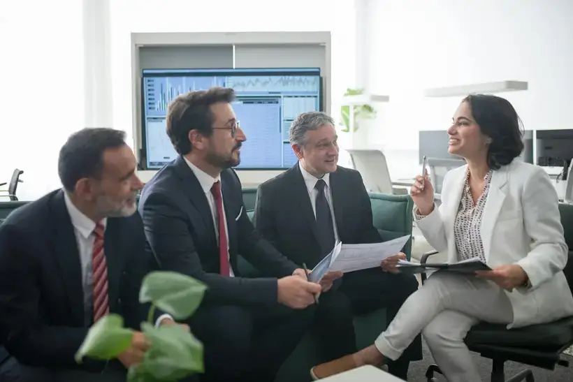 Woman Talking to Men at the Office